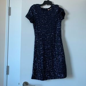New dark blue dress with original tag. Size S.